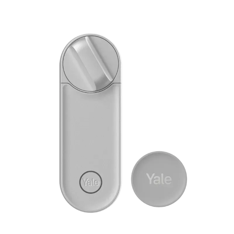 Yale Linus L2 argent vue de face, molette en haut, à côté de son badge rond Yale Dot